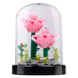 Building blocks of flowers in a glass bell jar