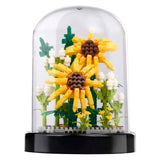 Building blocks of flowers in a glass bell jar