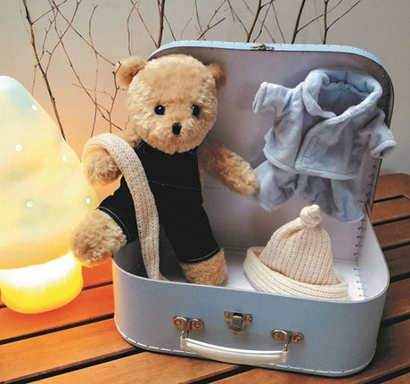 Egmont Morris with clothes in suitcase. 29x