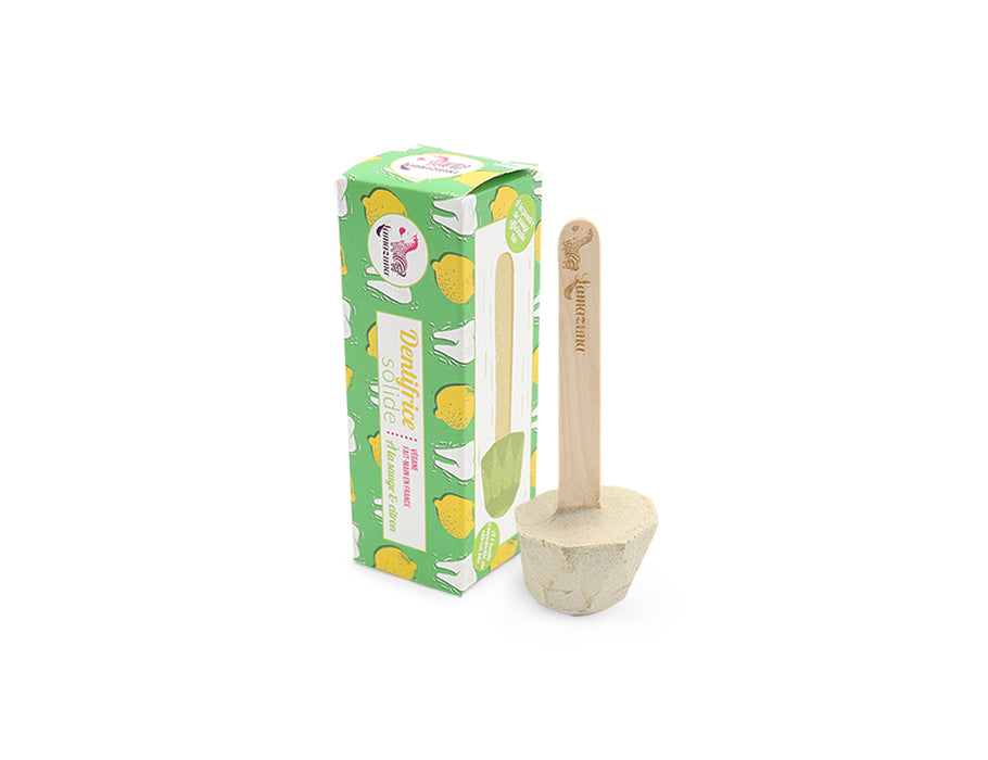 Lamazuna toothpaste on a stick of lemon sage